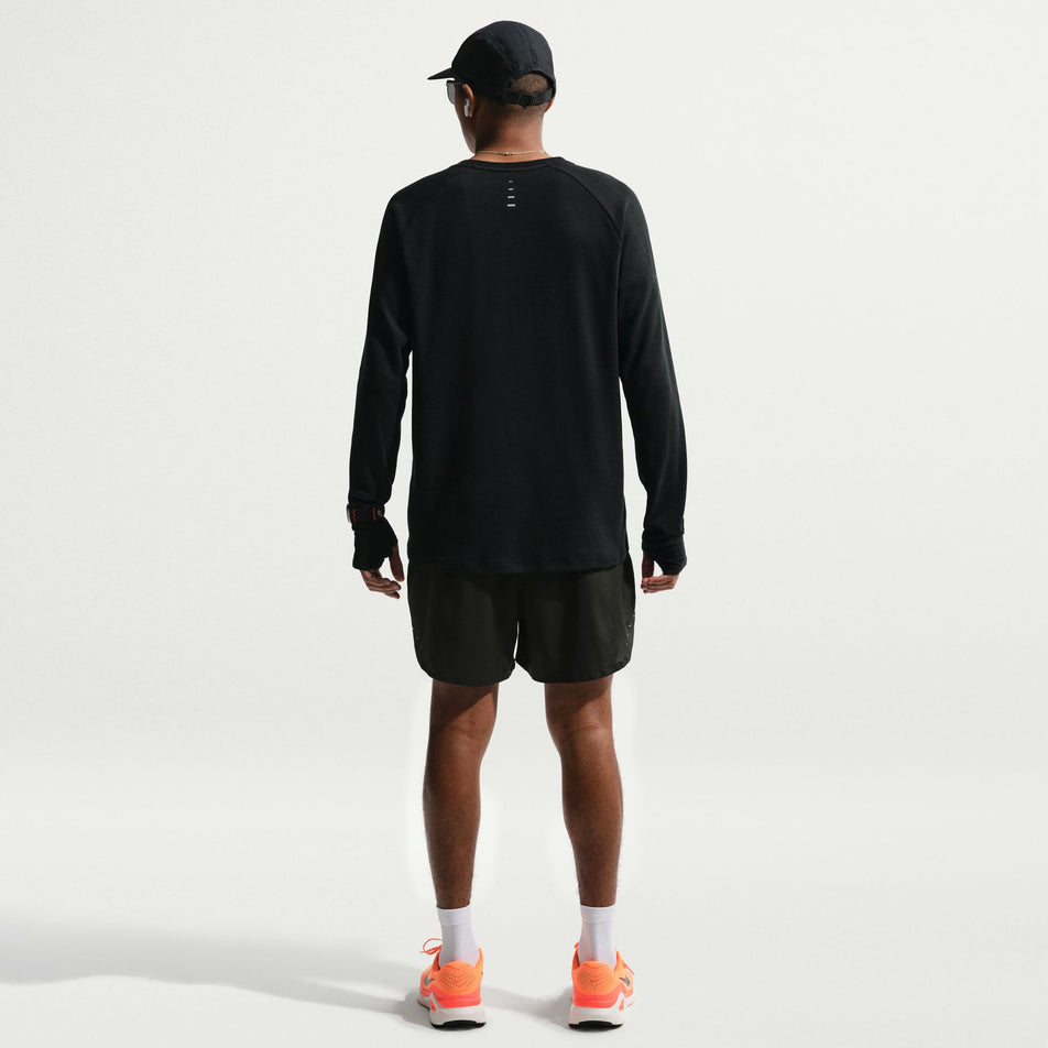 Back view of a model wearing the Nike Men's Stride Plus Dri-FIT 5