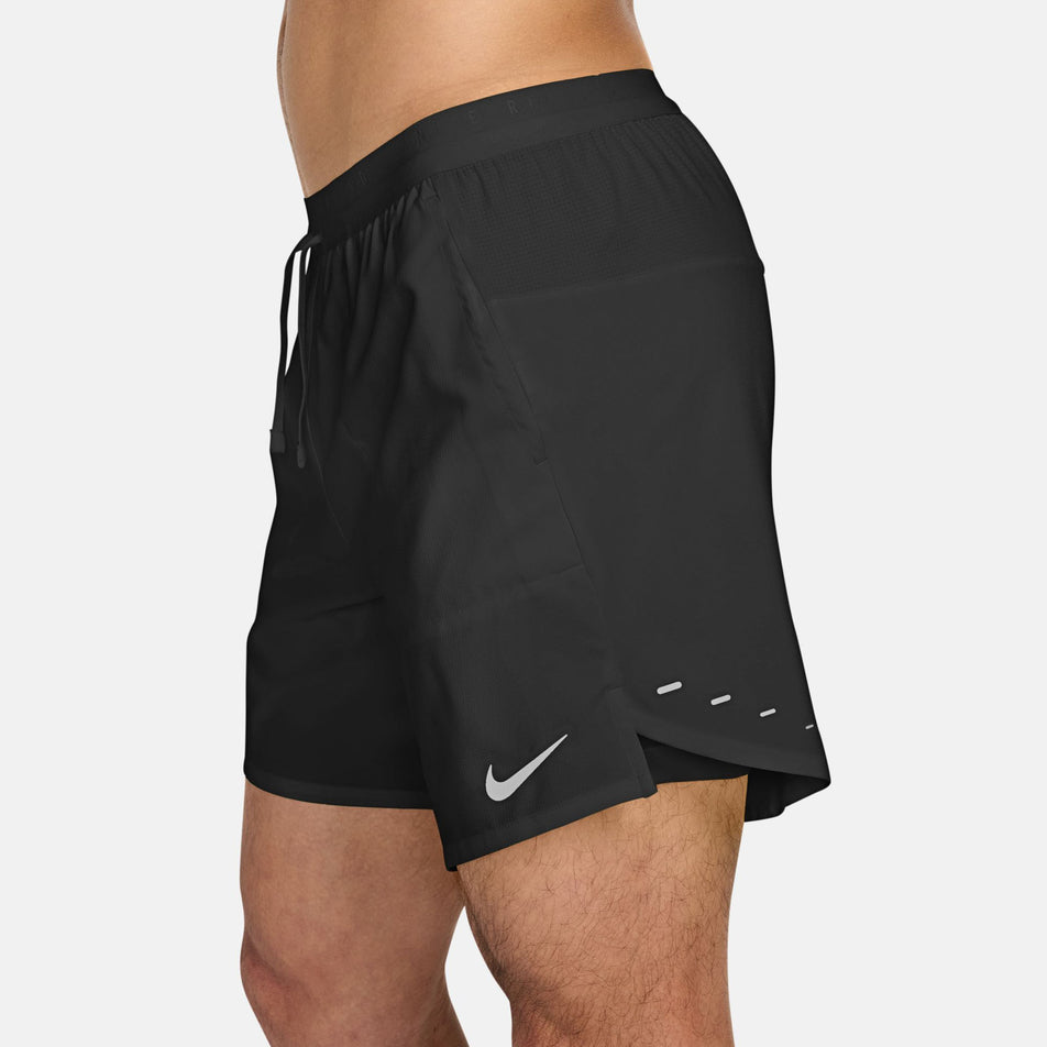 Side view of a model wearing the Nike Men's Stride Dri-FIT 7