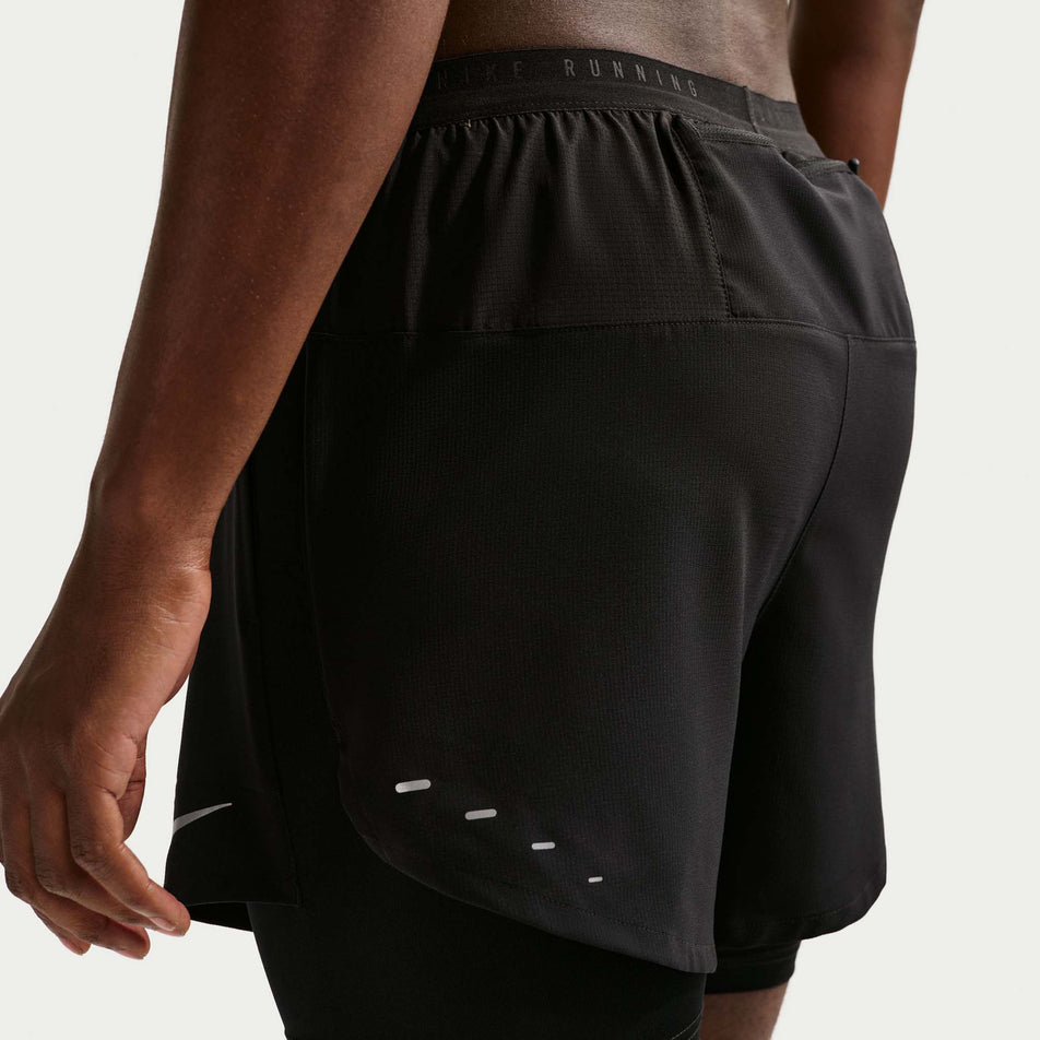 Angled view of a model wearing the Nike Men's Stride Dri-FIT 5