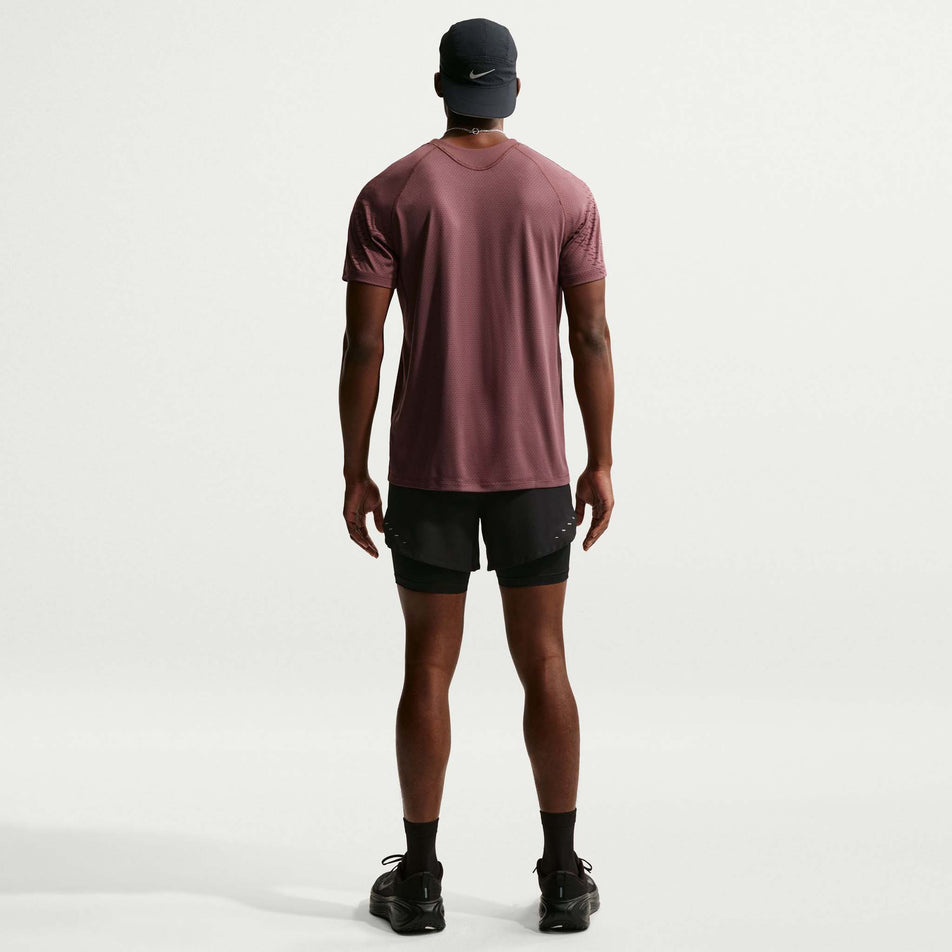 Back view of a model wearing the Nike Men's Stride Dri-FIT 5
