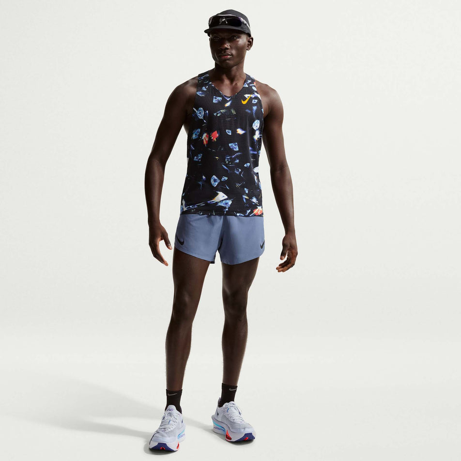 Front view of a model wearing the Nike Men's AeroSwift Dri-FIT ADV Running Singlet in the Black/Laser Orange colourway.