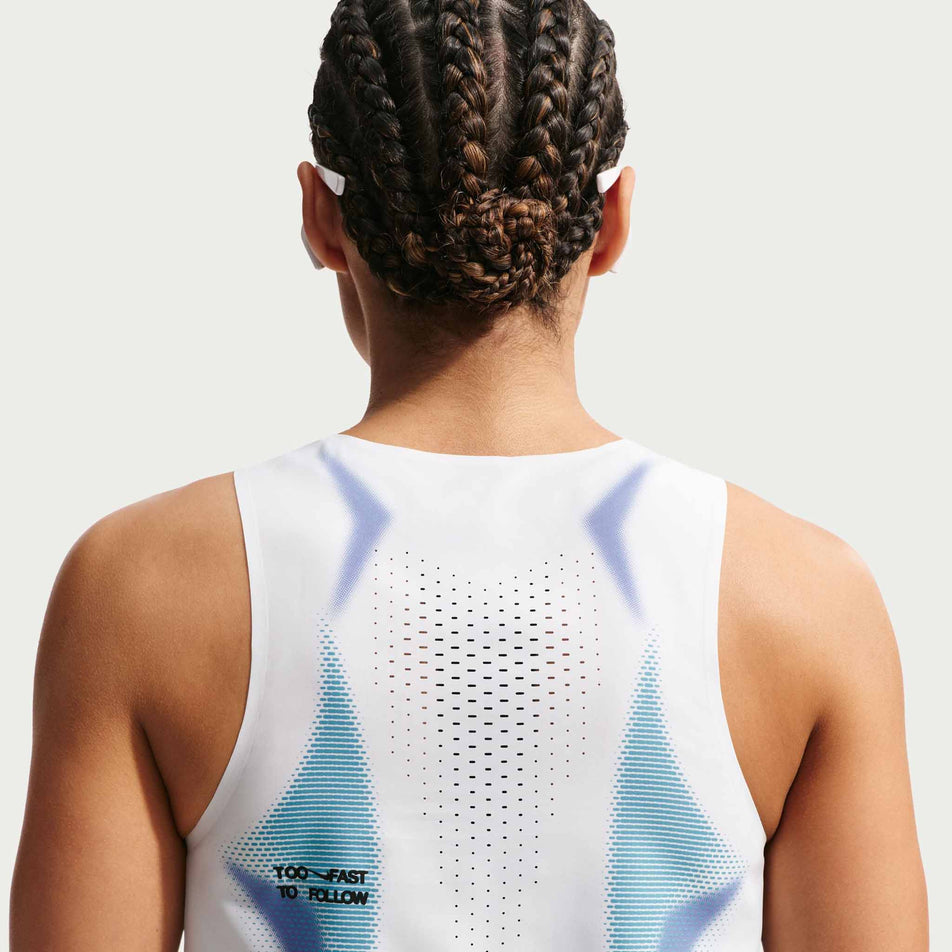 Back view of a model wearing the Nike Women's AeroSwift Dri-FIT ADV Cropped Running Tank Top in the White/Black/Black colourway.