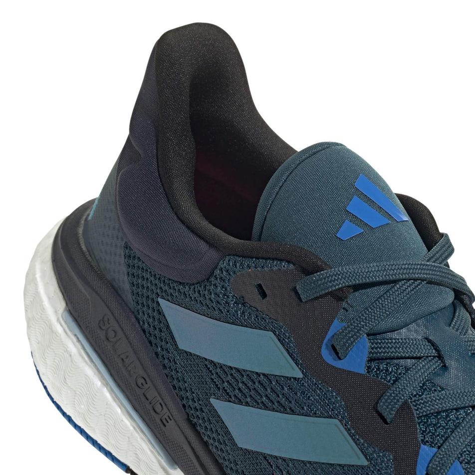 Lateral side of the back of the right shoe from a pair of adidas Men's Solarglide 6 Running Shoes in the Arctic Night/Core Black/Arctic Fusion colourway (7969125171362)