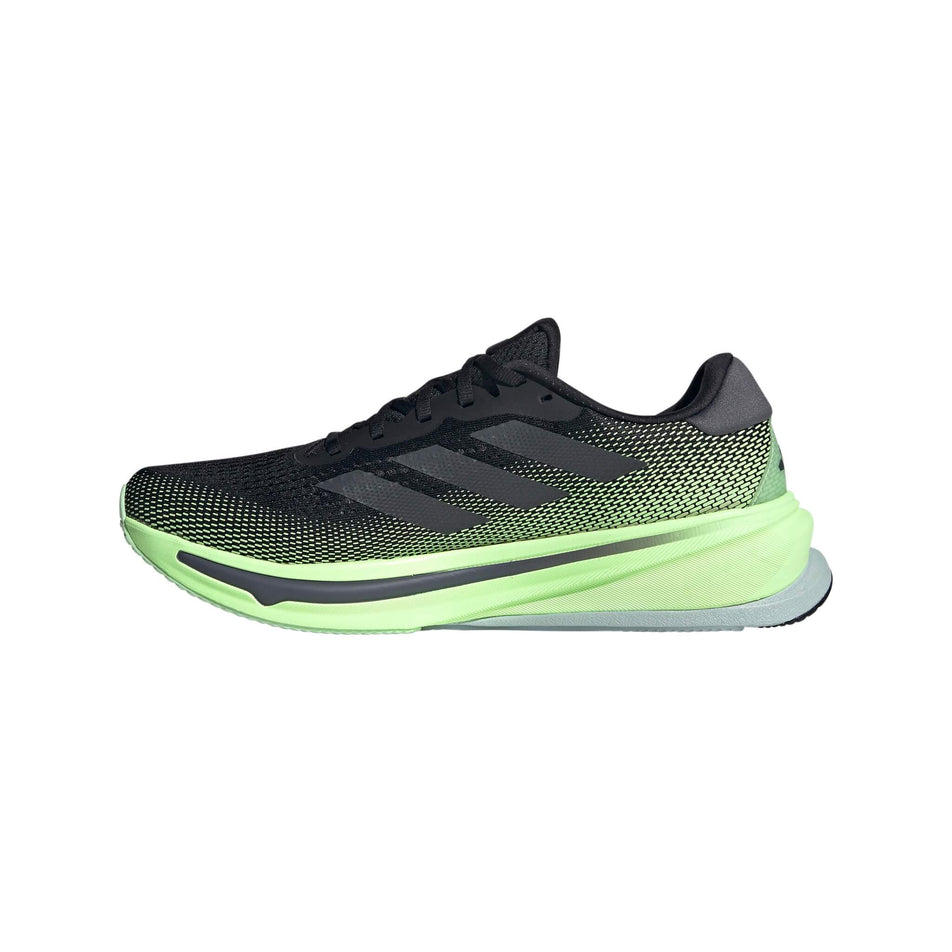 Medial side of the right shoe from a pair of adidas Men's Supernova Rise Running Shoes in the Core Black/Grey Five/Green Spark colourway (8115581714594)