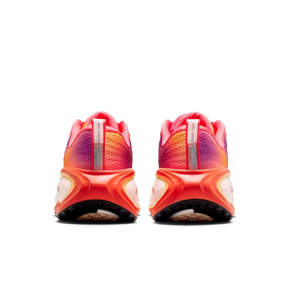 The back of a pair of Nike Women's Vomero Plus SE Road Running Shoes in the Ember Glow/Bordeaux-Marakesh colourway. (8764921872546)