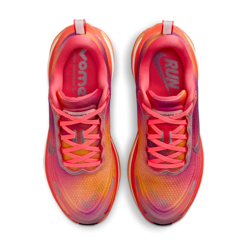 The uppers on a pair of Nike Women's Vomero Plus SE Road Running Shoes in the Ember Glow/Bordeaux-Marakesh colourway. (8764921872546)