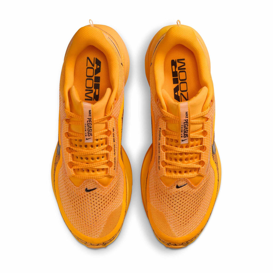 The uppers of a pair of Nike Men's Pegasus Premium Road Running Shoes in the University Gold/Black-Laser Orange colourway. (8683467800738)