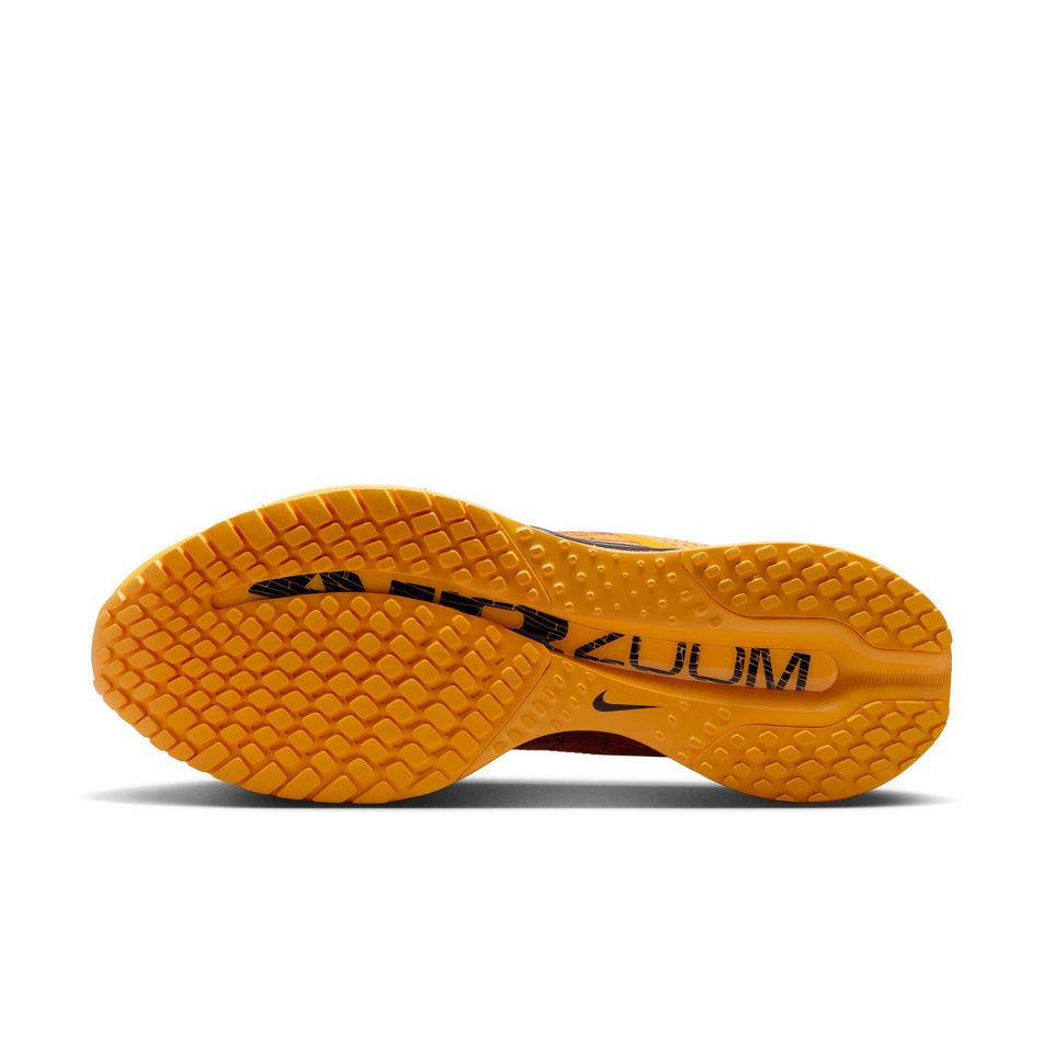 The outsole of the left shoe from a pair of Nike Men's Pegasus Premium Road Running Shoes in the University Gold/Black-Laser Orange colourway. (8683467800738)