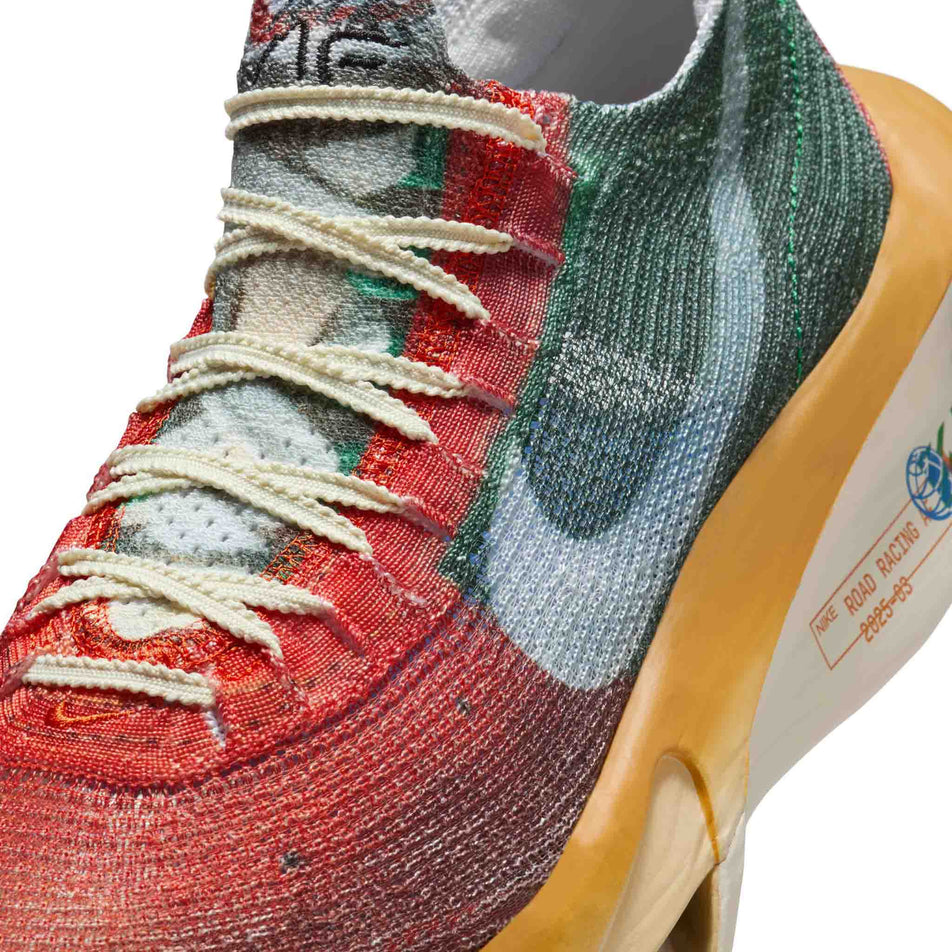 Close-up view of the upper of the left shoe from a pair of Nike Men's Alphafly 3 Premium Road Racing Shoes in the Multi-Color/Clear-Starfish-Aloe Verde  colourway. (8723627344034)