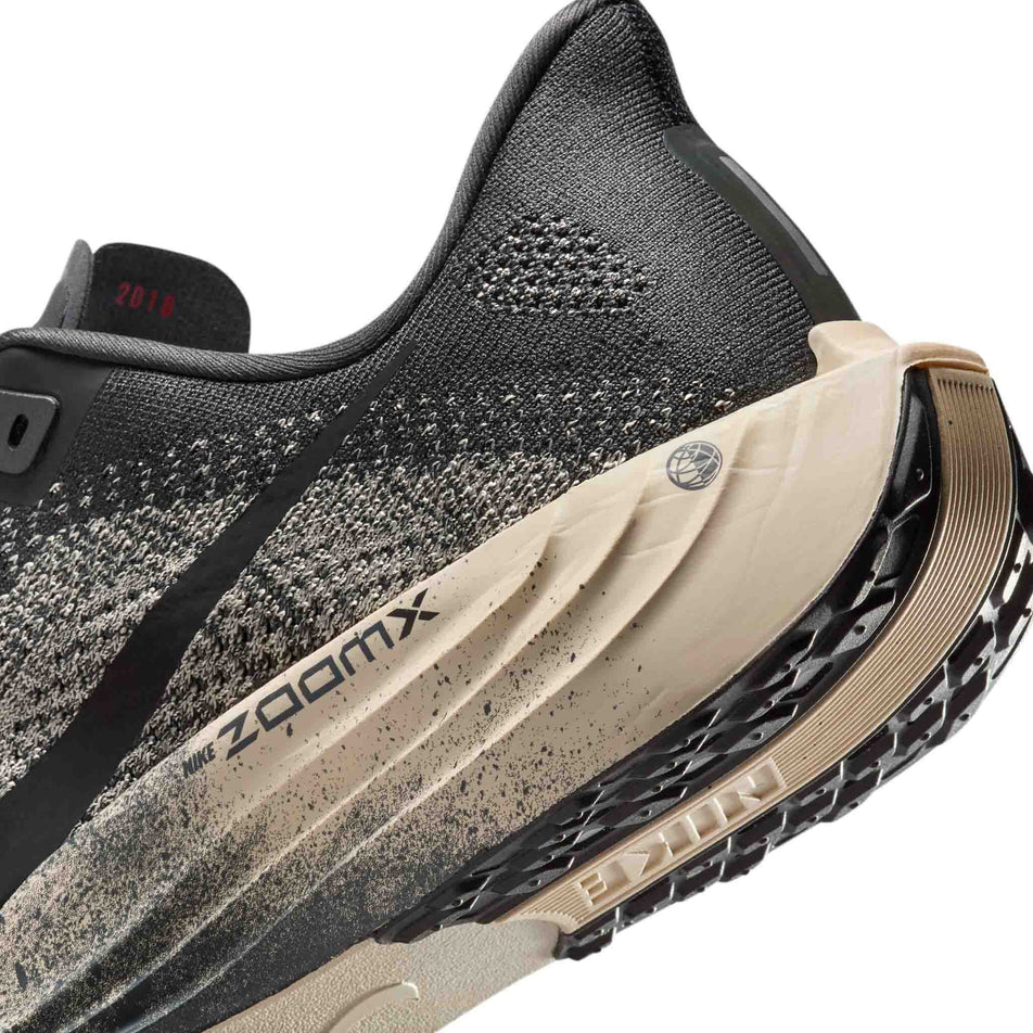Close up of the midsole of the left shoe from a pair of Nike Men's Pegasus Plus Road Running Shoes in the Oatmeal/Black-Anthracite-Volt colourway. (8683765563554)