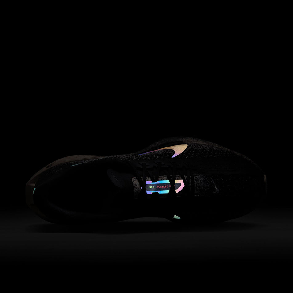 The reflective graphics on the upper of the Nike Men's Pegasus Plus Road Running Shoes in the Oatmeal/Black-Anthracite-Volt colourway. (8683765563554)