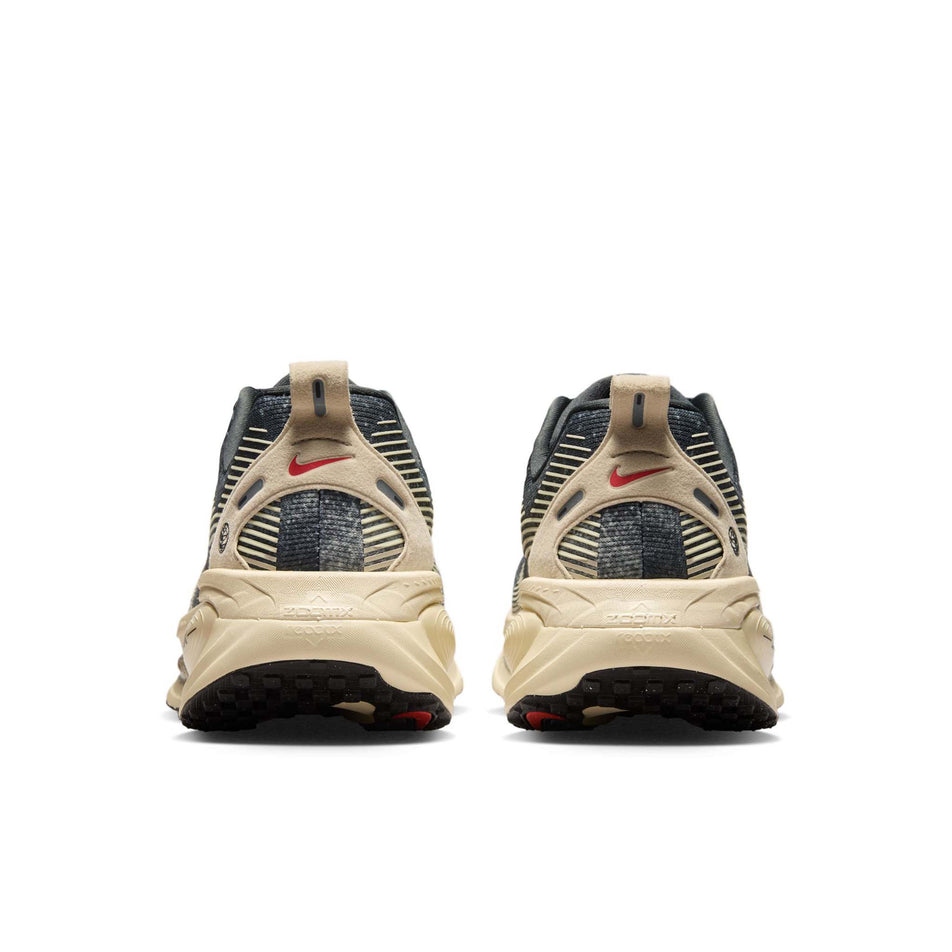 The back of a pair of Nike Men's Vomero 18 Road Running Shoes in the Oatmeal/Black-Anthracite-Volt colourway. (8684581552290)