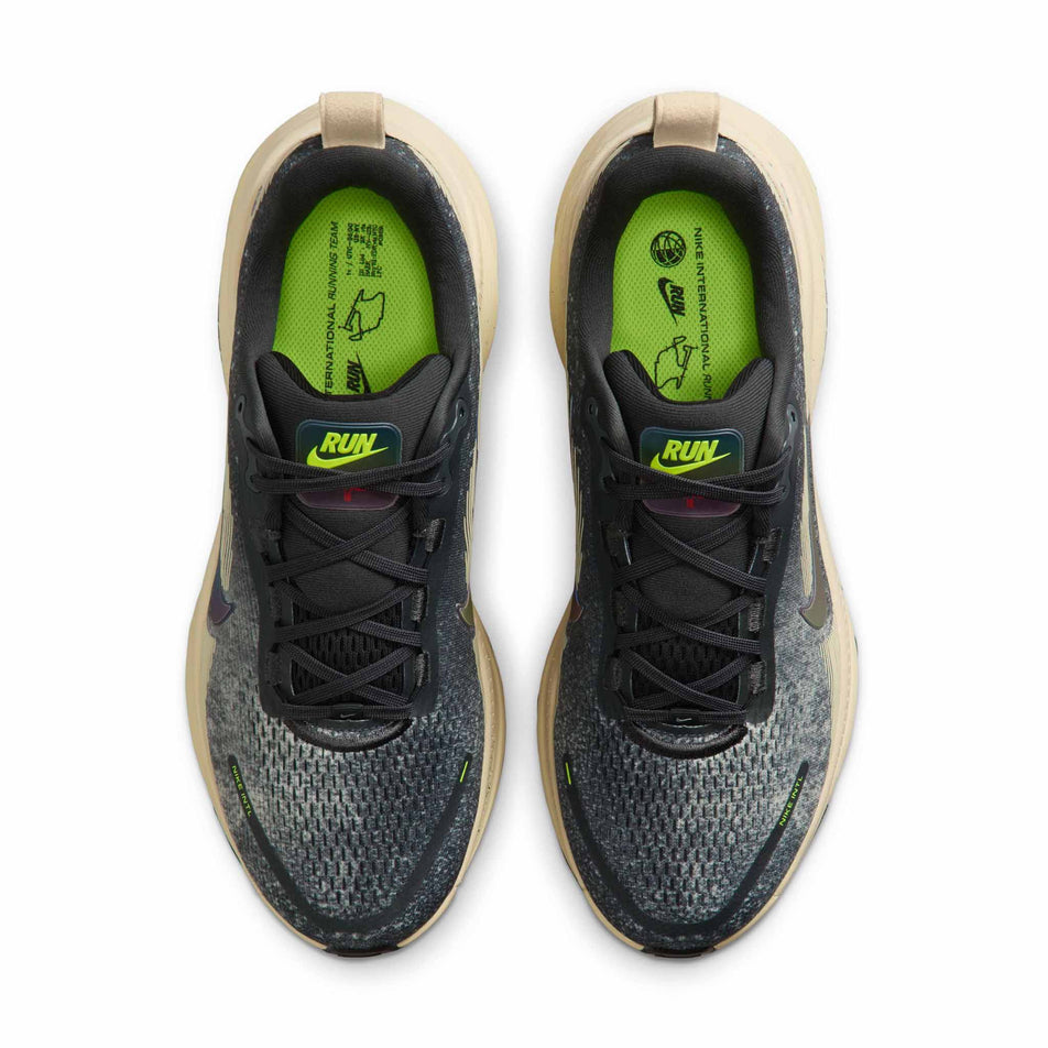 The uppers of a pair of Nike Men's Vomero 18 Road Running Shoes in the Oatmeal/Black-Anthracite-Volt colourway. (8684581552290)