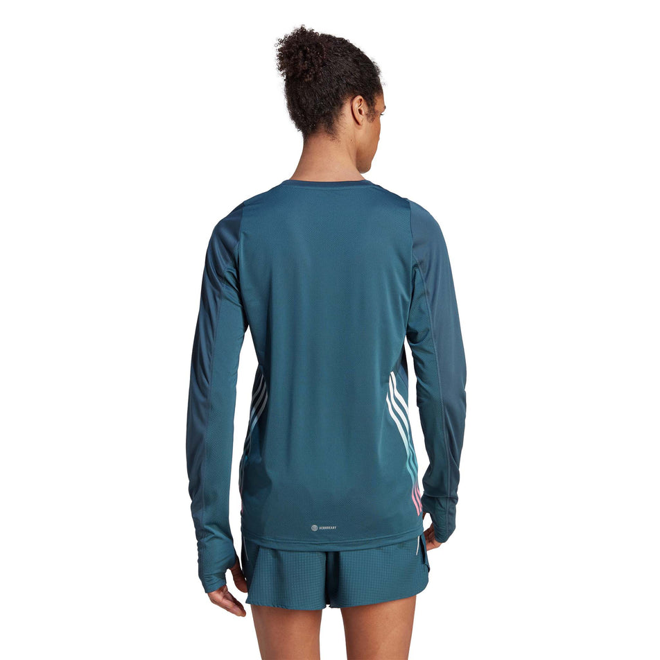 Back view of a model wearing an adidas Men's Run Icons 3-Stripes Long Sleeve Top in the Arctic Night colourway (8005293670562)