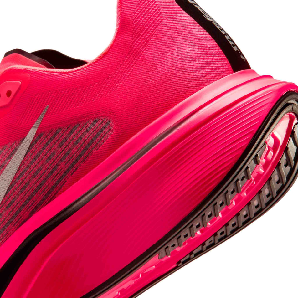 Close-up view of the rearfoot section of the left shoe from a pair of Nike Men's Pegasus Plus 2 Road Running Shoes in the Flash Crimson/Metallic Silver-Black colourway.