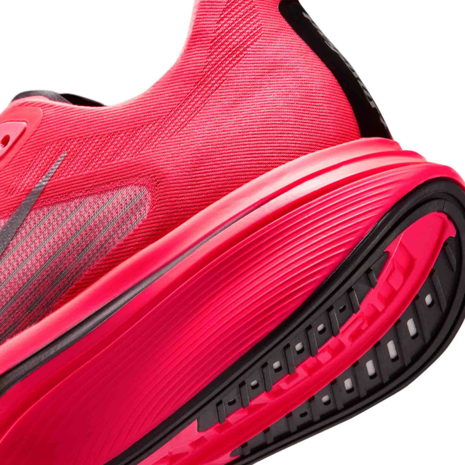 Close-up view of the left section of the left shoe from a pair of Nike Women's Pegasus Plus 2 Road Running Shoes in the Flash Crimson/Metallic Silver-Black colourway.