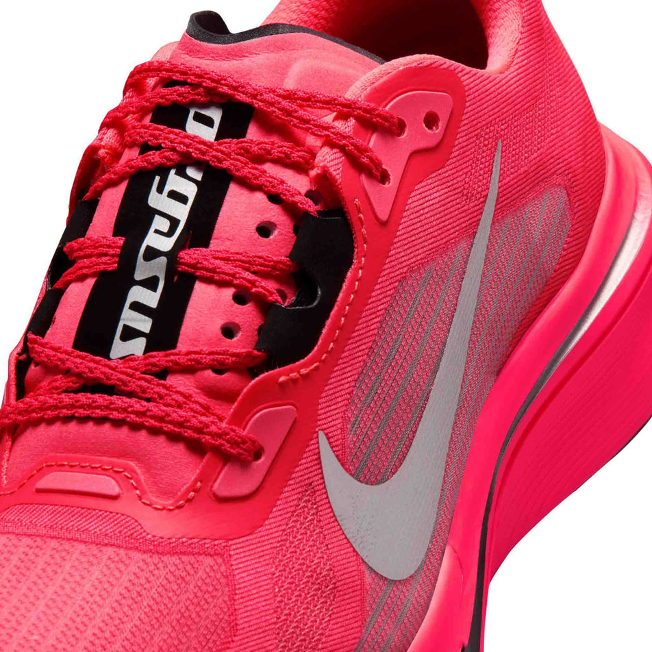 Close-up view of the upper of the left shoe from a pair of Nike Women's Pegasus Plus 2 Road Running Shoes in the Flash Crimson/Metallic Silver-Black colourway.