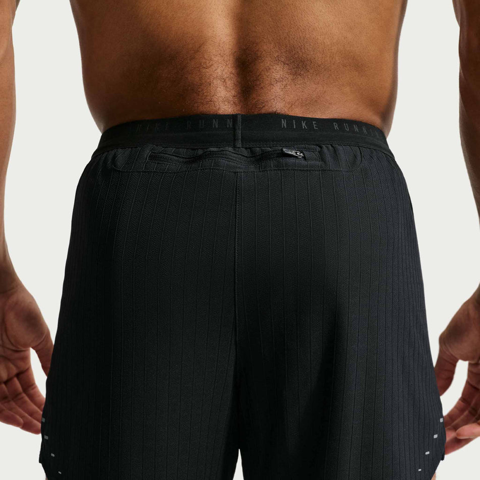 Back view of a model wearing the Nike Men's Stride Aero-FIT 5