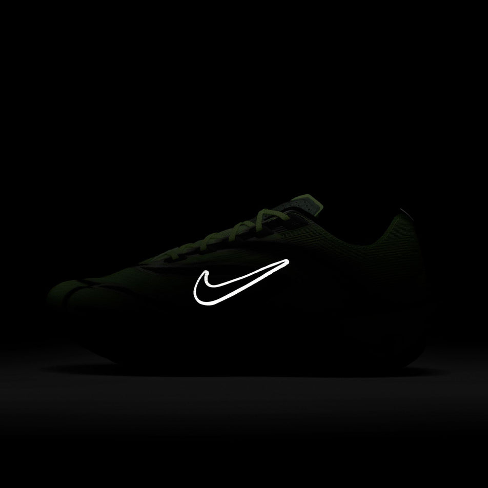 The reflective Swoosh logo on the lateral side of the left shoe from a pair of Nike Men's Vaporfly 4 Road Racing Shoes in the Multi-Color/Black-Volt-White colourway. (8791535026338)