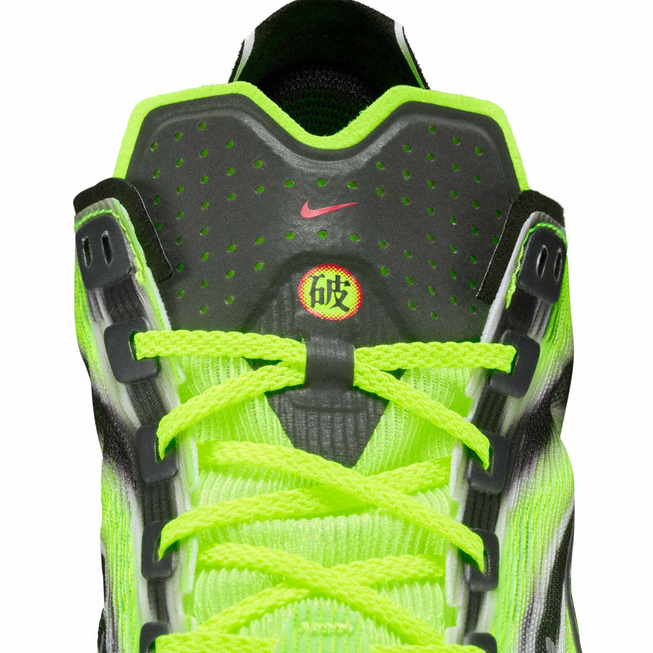 Close-up view of the tongue of the left shoe from a pair of Nike Men's Vaporfly 4 Road Racing Shoes in the Multi-Color/Black-Volt-White colourway. (8791535026338)