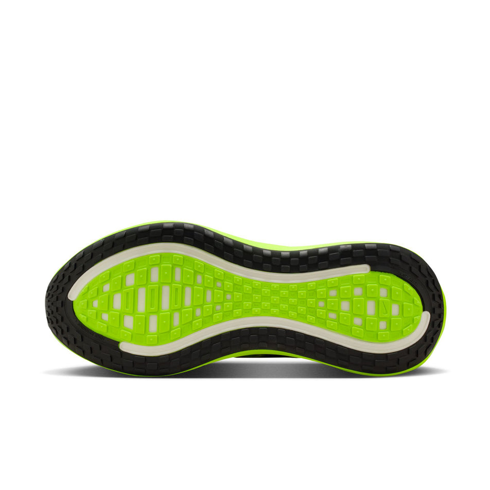 The outsole of the left shoe from a pair of Nike Men's Vomero Plus SE Road Running Shoes in the Multi-Color/Black-Volt-White colourway.