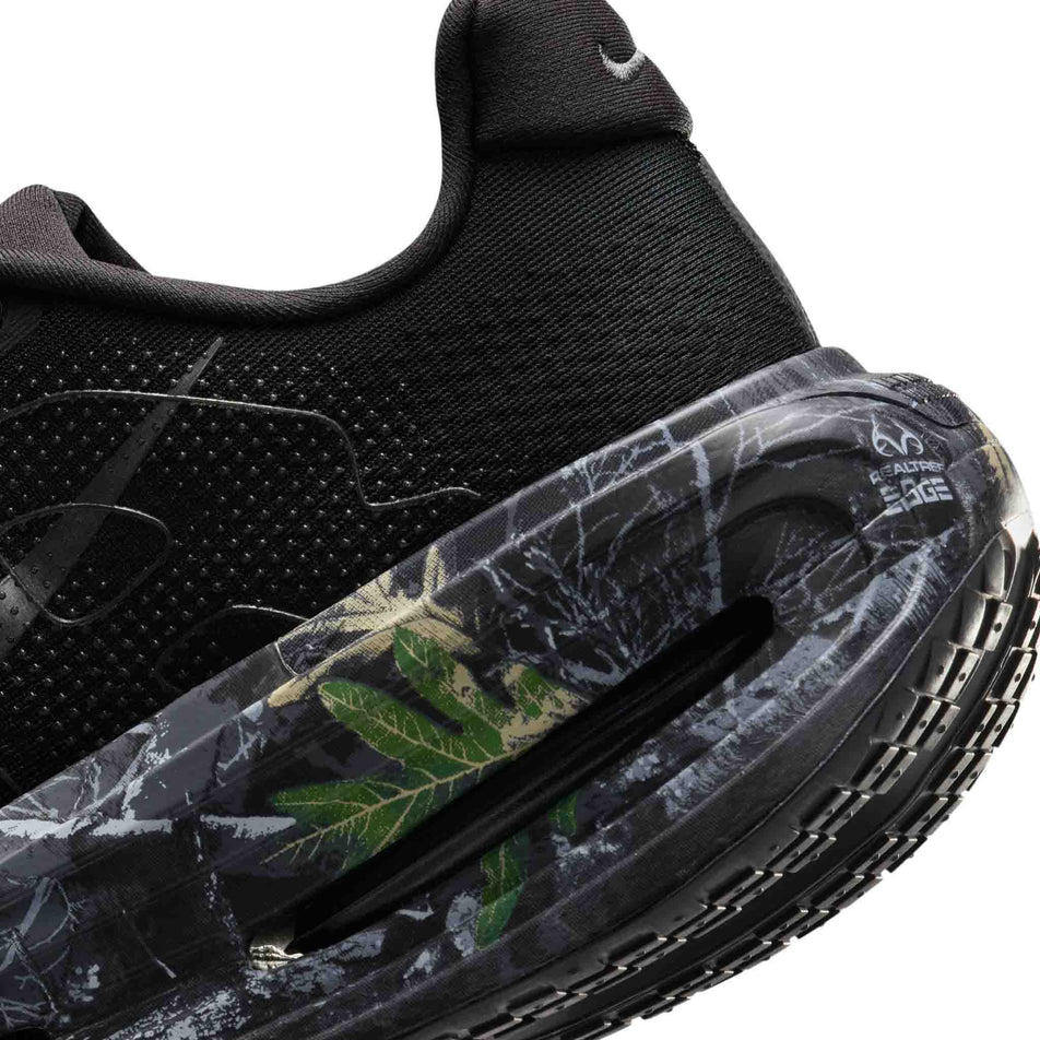 Close-up view of the Realtree® camo print on the left shoe from a pair of Nike Men's Vomero Premium Realtree® Road Running Shoes in the Black/Dark Smoke Grey/Anthracite/Metallic Dark Grey colourway.