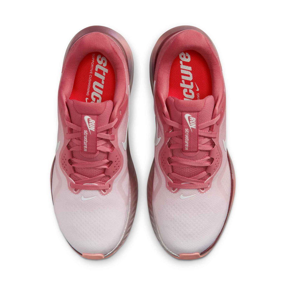 The uppers of a pair of Nike Women's Structure 26 Road Running Shoes in the Light Redwood/Barely Green-Team Red colourway.
