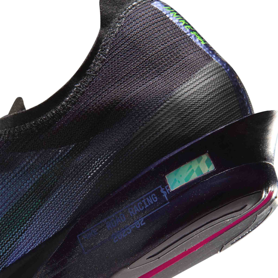 Close-up view of the rearfoot section of the left shoe from a pair of Nike Men's Streakfly 2 Glam Road Racing Shoes in the Dark Obsidian/Black-Electric Green colourway.