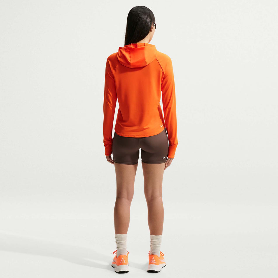 Back view of a model wearing the Nike Women's ACG Dri-FIT High-Waisted 4