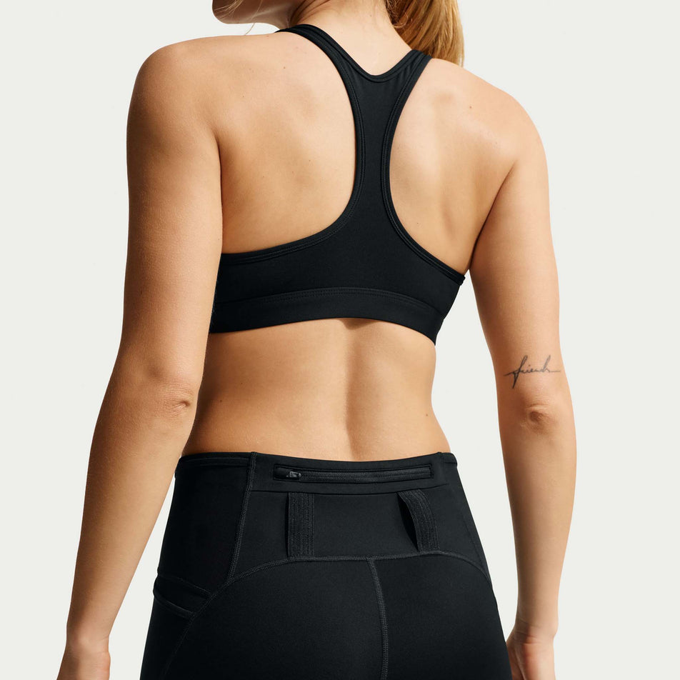Back view of a model wearing the Nike Women's ACG Dri-FIT High-Waisted 4