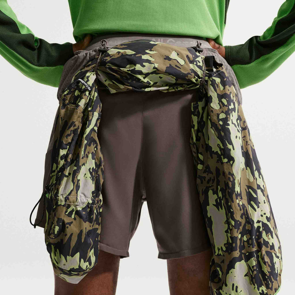 A jacket stowed in the loops on the back of the Nike Men's ACG 