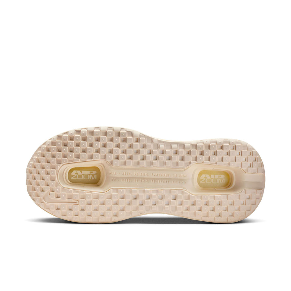 The outsole of the left shoe from a pair of Nike Women's Vomero Premium Road Running Shoes in the  Chalk/White-Pale Ivory-Summit White colourway.