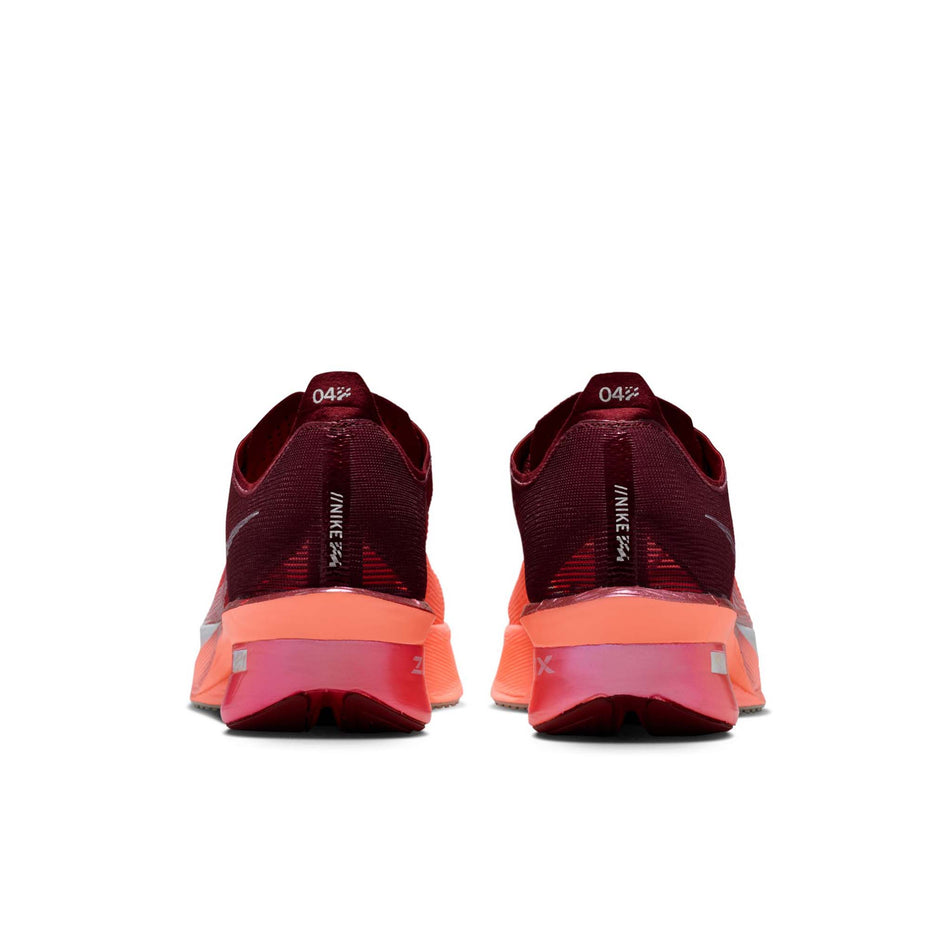 The back of a pair of Nike Women's Vaporfly 4 SE Road Racing Shoes in the Team Red/Barely Green-Atomic Pink colourway.