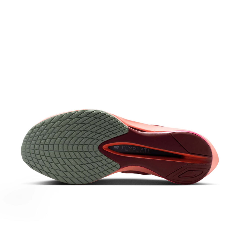 The outsole of the left shoe from a pair of Nike Women's Vaporfly 4 SE Road Racing Shoes in the Team Red/Barely Green-Atomic Pink colourway.