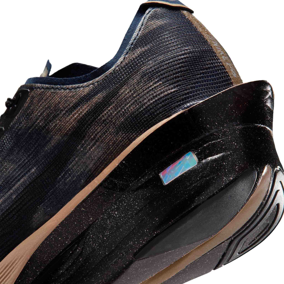 Close-up view of the rearfoot section of the left shoe from a pair of Nike Women's Vaporfly 4 
