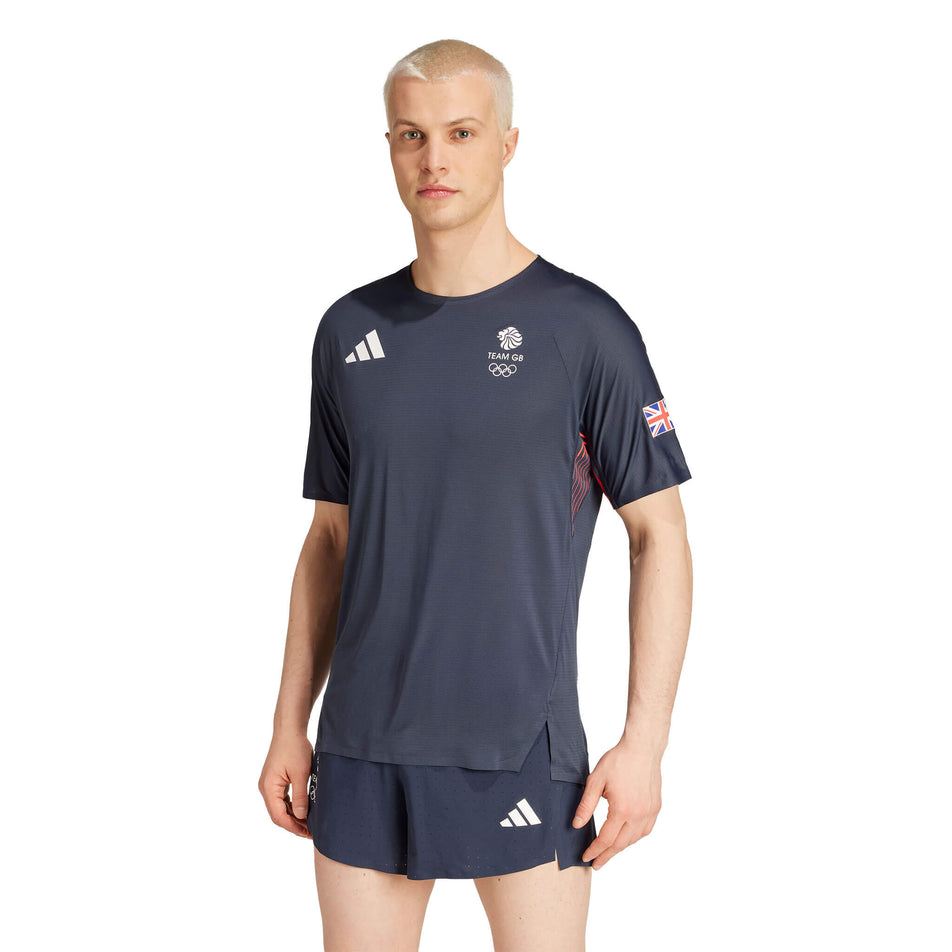 Front view of a model wearing an adidas Men's Team GB Adizero Running T-Shirt in the Legend Ink colourway. Model is also wearing adidas shorts. (8324017553570)