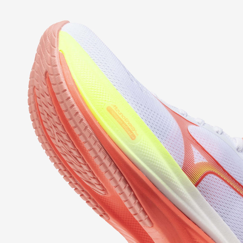 Lateral view of the left shoe from a pair of Mizuno Women's Wave Rider 30 Running Shoes in the White/Flamingo Coral/Lime Pulp colourway.