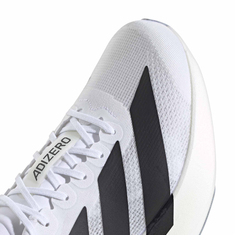 Close-up view of the toebox of the right shoe from a pair of adidas Men's Adizero EVO SL Running Shoes in the Ftwr White/Core Black/Ftwr White colourway.