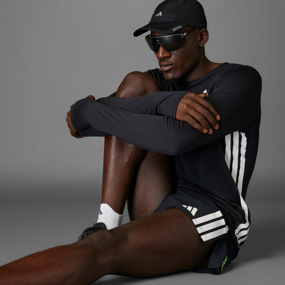 Angled view of a model wearing the adidas Men's Adizero Gel Pocket Shorts in the Black colourway.