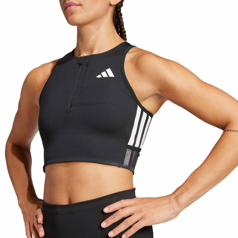 Front view of a model wearing the adidas Women's Adizero Running Gel Pocket Crop in the Black colourway.