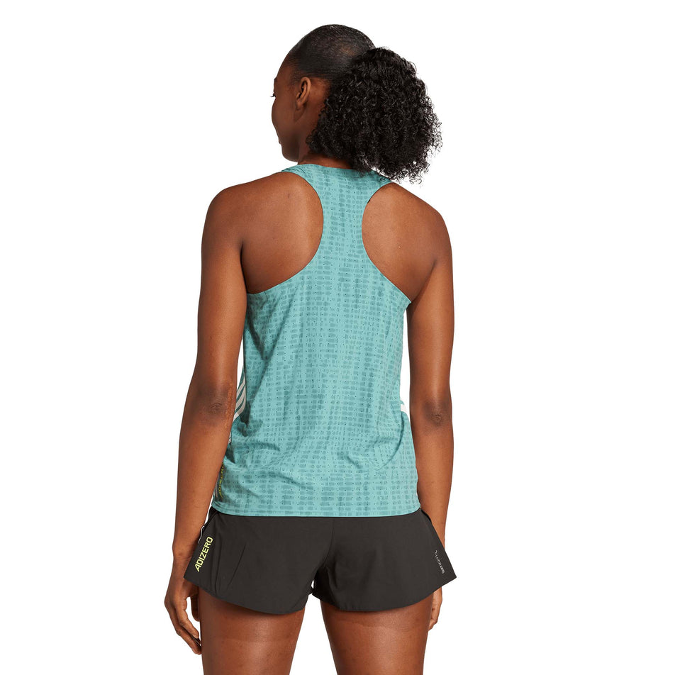 Back view of a model wearing the adidas Women's Adizero Singlet in the Powder Teal/Preloved Teal colourway. (8665224315042)
