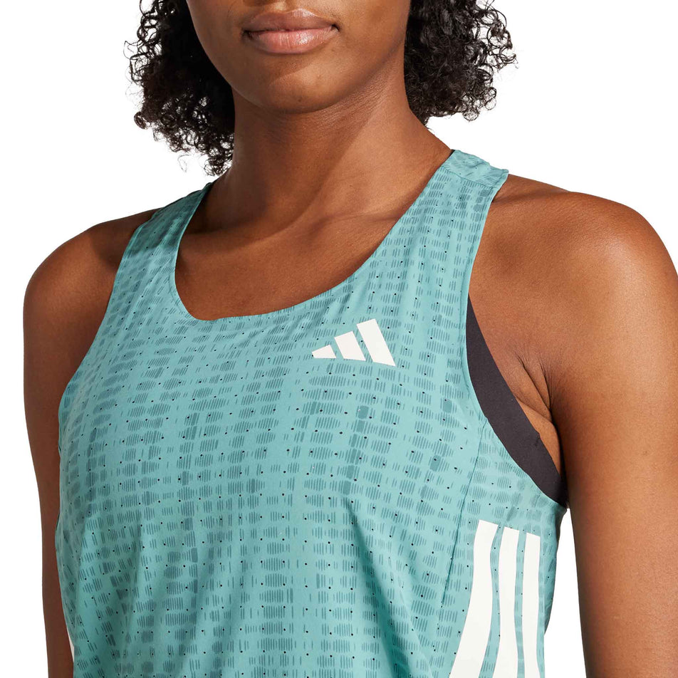 Front view of a model wearing the adidas Women's Adizero Singlet in the Powder Teal/Preloved Teal colourway. (8665224315042)