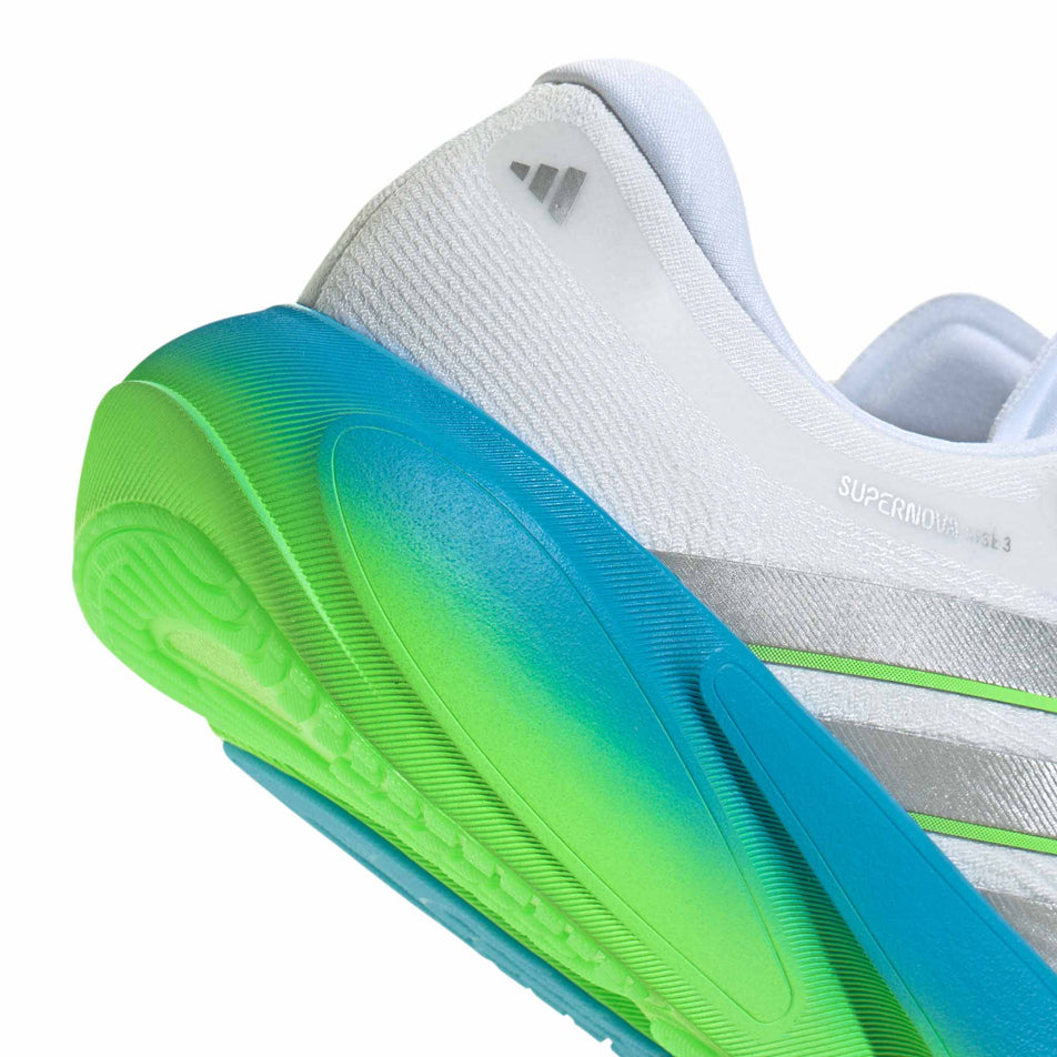 The rearfoot section of the right shoe from a pair of adidas Men's Supernova Rise 3 Running Shoes in the Ftwr White/Silver met./Semi Blue Burst colourway.