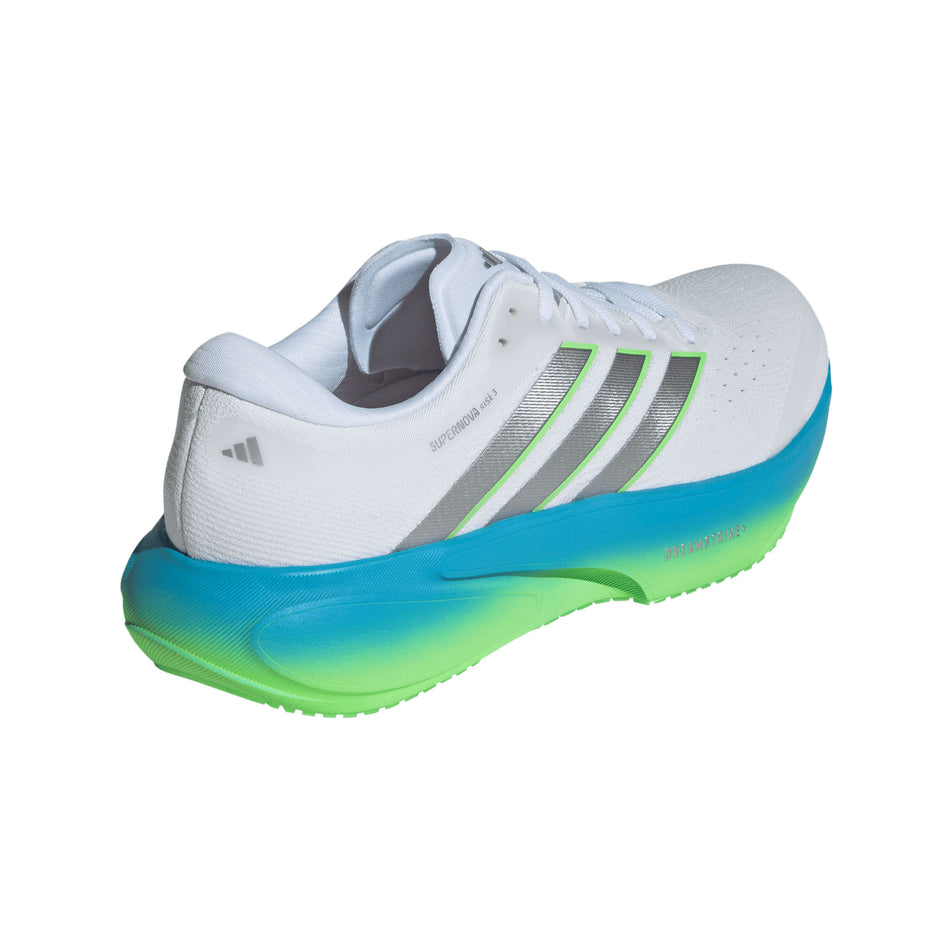 Lateral view of the right shoe from a pair of adidas Men's Supernova Rise 3 Running Shoes in the Ftwr White/Silver met./Semi Blue Burst colourway.