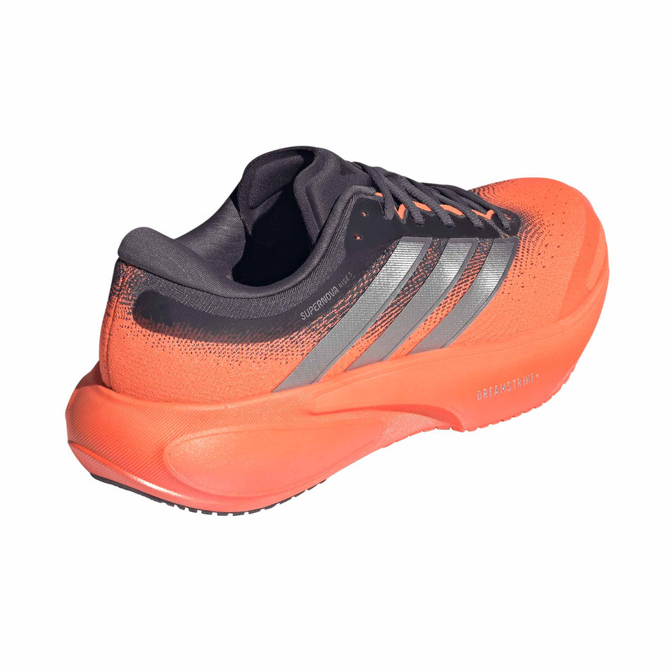 Lateral view of the right shoe from a pair of adidas Men's Supernova Rise 3 Running Shoes in the Aurora Onix/Silver met./Lucid Orange colourway.