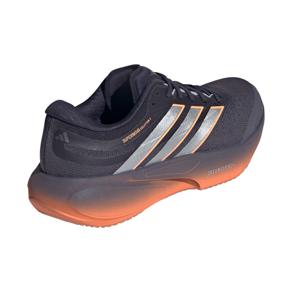 Lateral view of the right shoe from a pair of adidas Men's Supernova Solution 3 Running Shoes in the Aurora Onix/Silver met./Lucid Orange colourway.