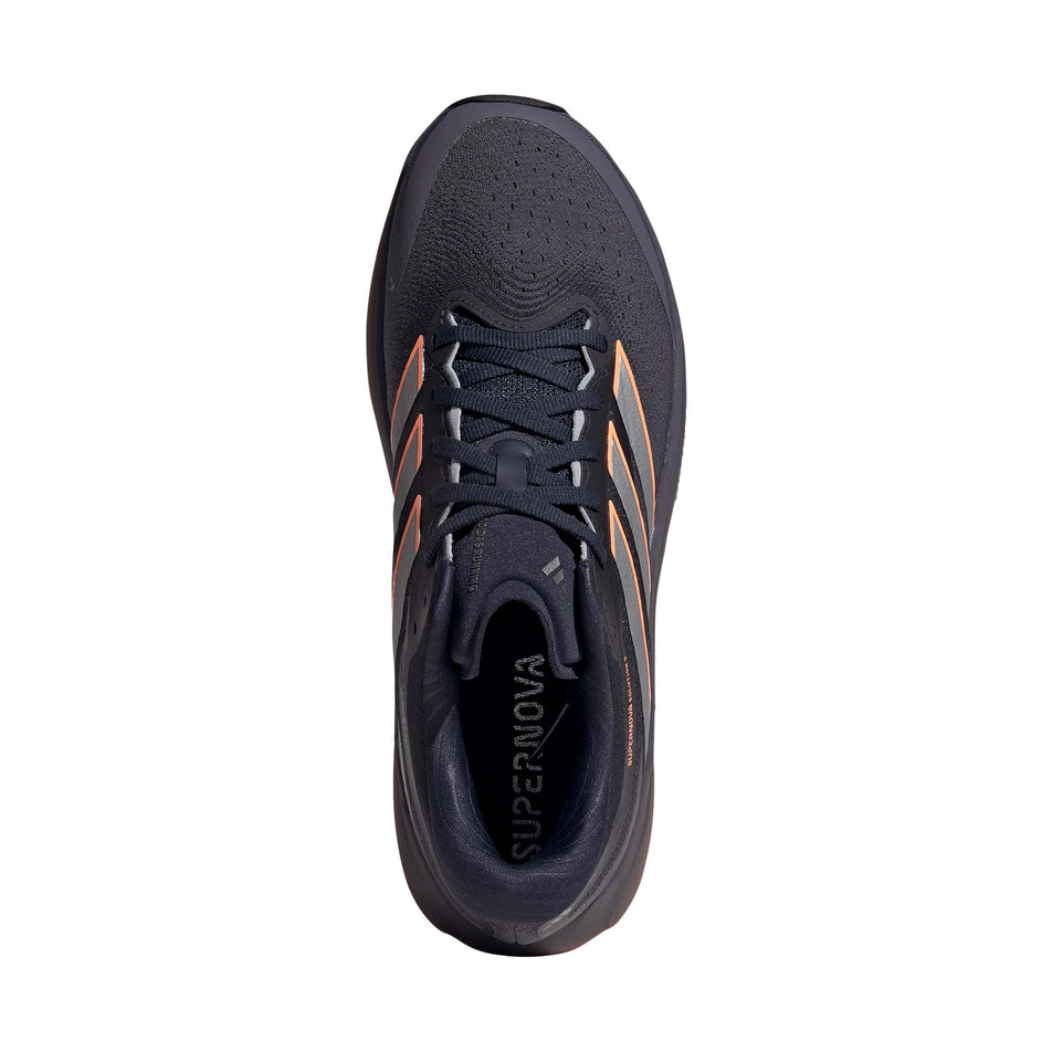 The upper of the right shoe from a pair of adidas Men's Supernova Solution 3 Running Shoes in the Aurora Onix/Silver met./Lucid Orange colourway.