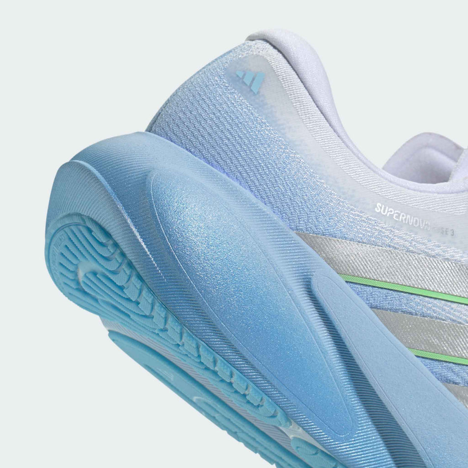 The rearfoot section of the right shoe from a pair of adidas Women's Supernova Rise 3 Running Shoes in the Glow Blue/Silver met./Ftwr White colourway.