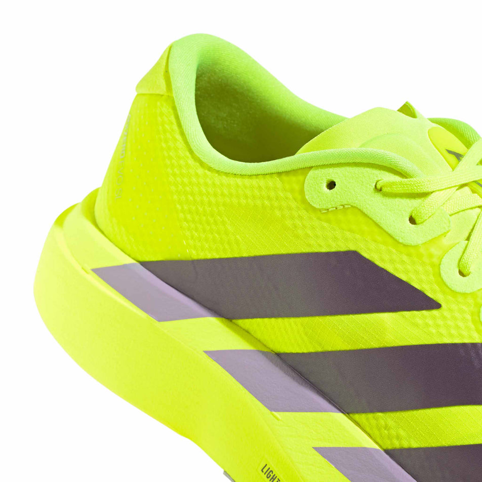 The rearfoot section of the right shoe from a pair of adidas Men's Adizero EVO SL Woven Running Shoes in the Solar Yellow/Aurora Plum/Powder Plum colourway.