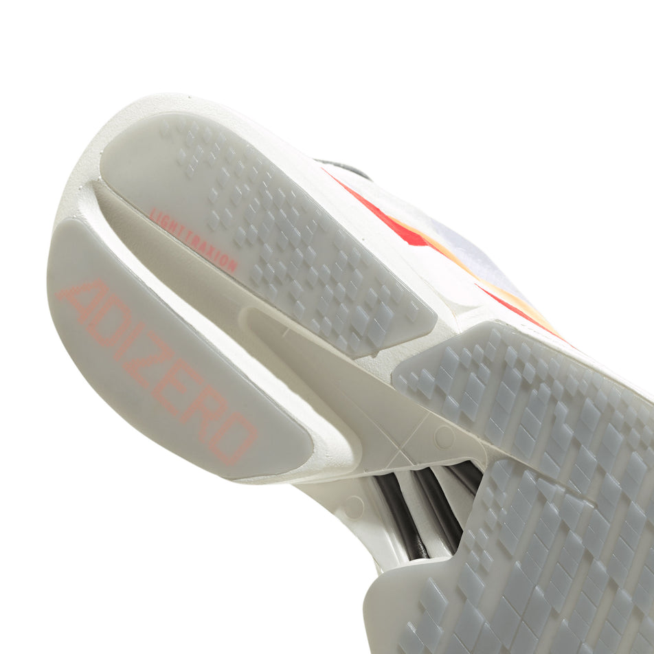 The rearfoot section of the right shoe from a pair of adidas Women's Adizero Adios Pro 4 Running Shoes in the Ftwr White/Beam Orange/Lucid Red colourway.